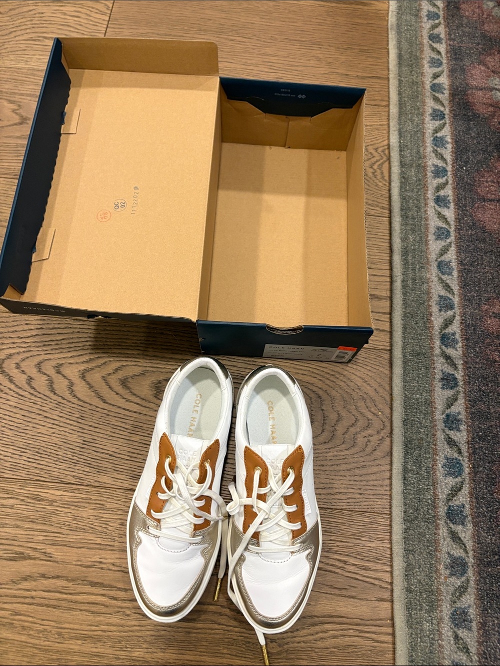 Cole Haan White and Tan woman’s Leather Sneakers